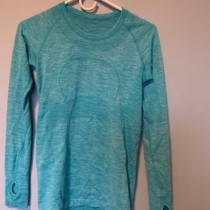 Lulu lemon light blue tight fitting long sleeve.